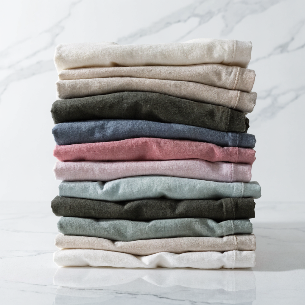 Premium cotton t-shirts in various colors neatly stacked